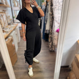 Black V - Neck Jumpsuit - Peplum Clothing